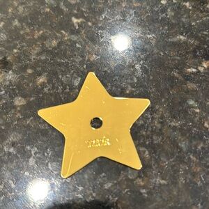 Dior golden metal star